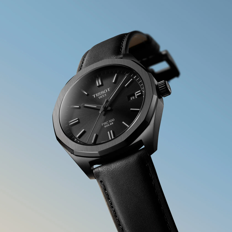 Tissot PRC 100 Solar Quartz 39mm watch on a colored background