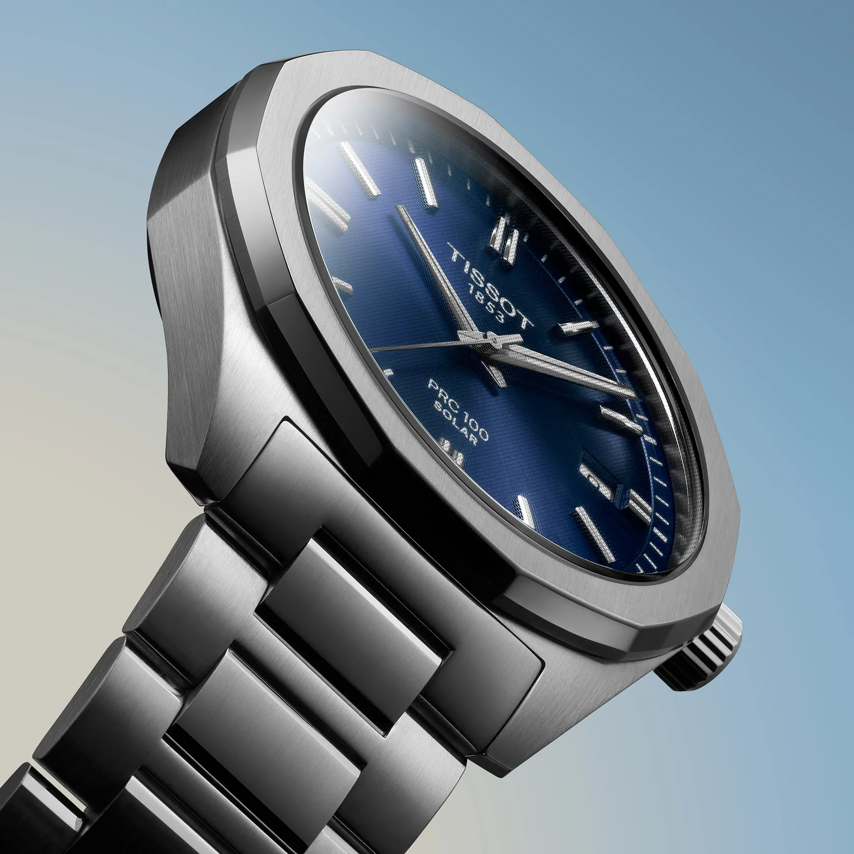 Tissot PRC 100 Solar Quartz 39mm watch on a colored background