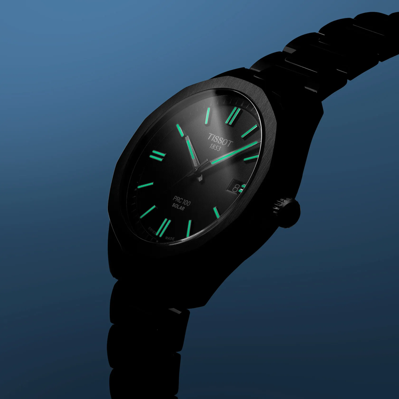 Tissot PRC 100 Solar Quartz 39mm watch on a colored background