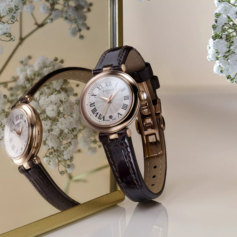 Tissot Bellissima small lady watch on a colored background