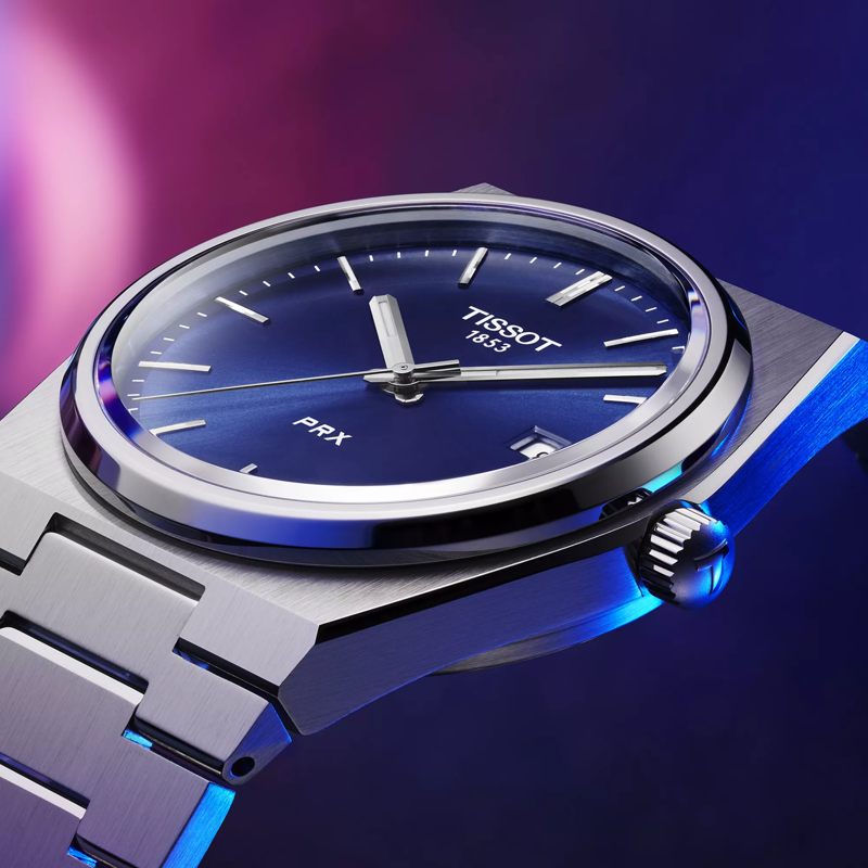 Tissot PRX 40mm watch on a colored background