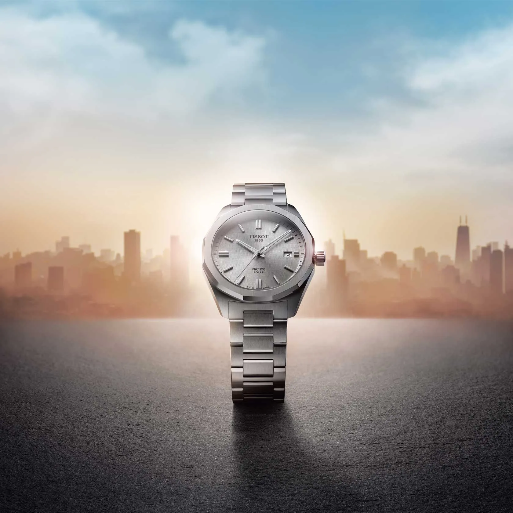 Tissot PRC 100 Solar Quartz 39mm watch on a colored background